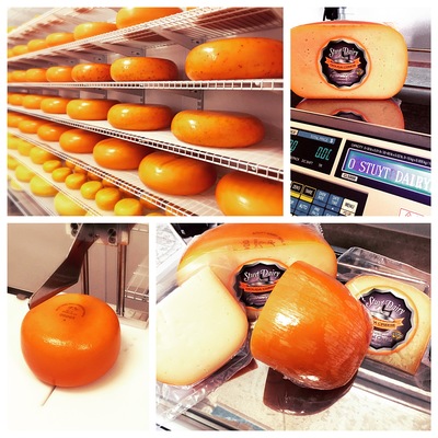 Image contains cheese wheels in cold storage, whole wheel cheese, half wheel cheese and quarter wheel cheese.